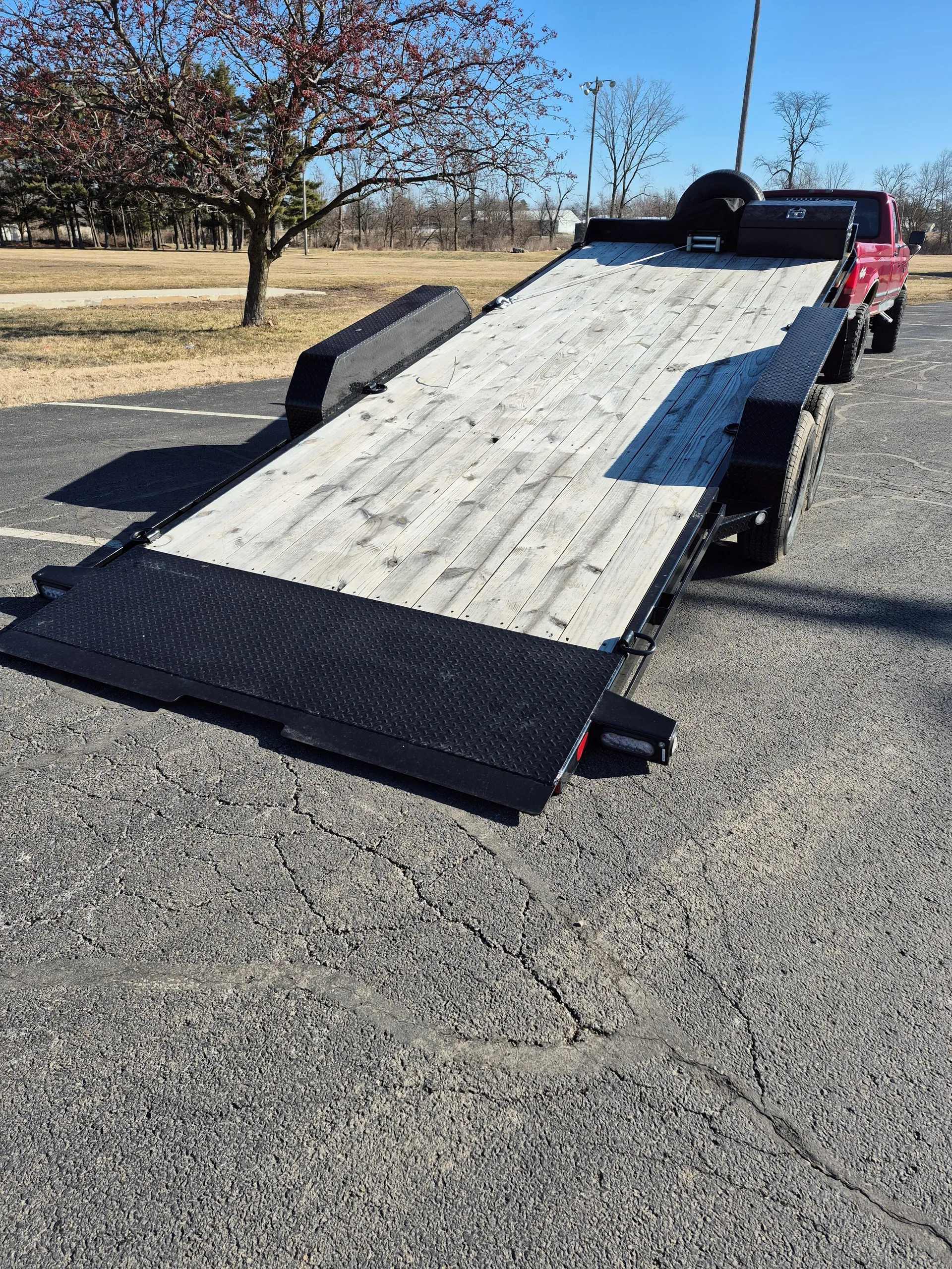 Tilt trailer rental in Greenfield IN - hydraulic tilt bed trailer for easy loading of vehicles and heavy machinery